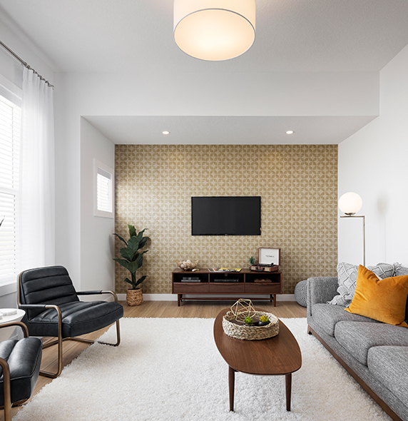 a living room with a couch, coffee table and a tv