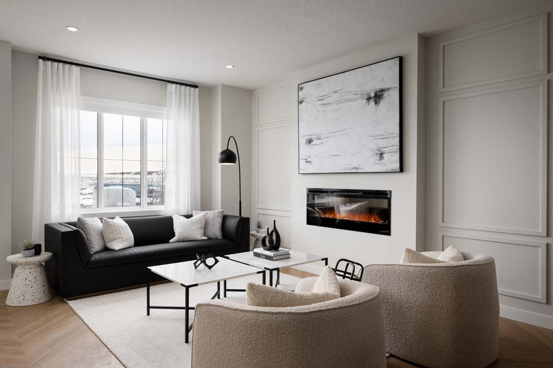 a living room with a couch, coffee table and a television