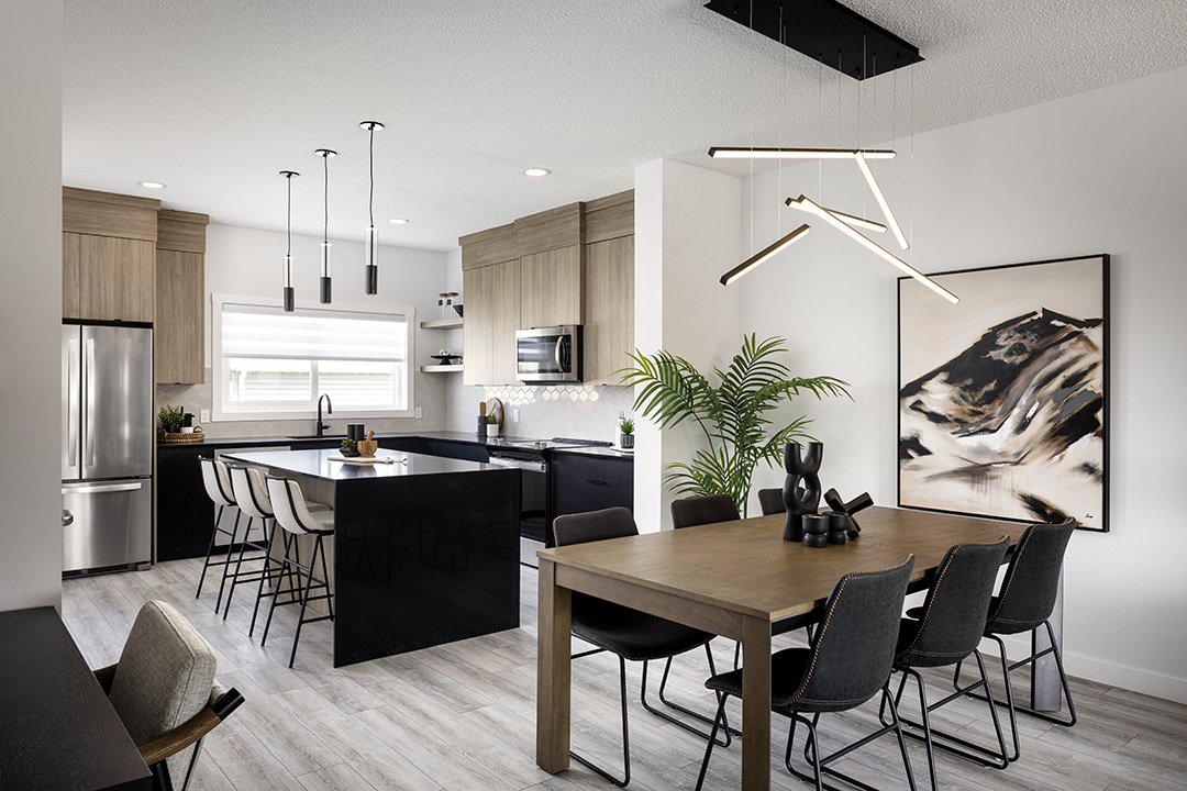 a kitchen with a table, chairs, and a refrigerator