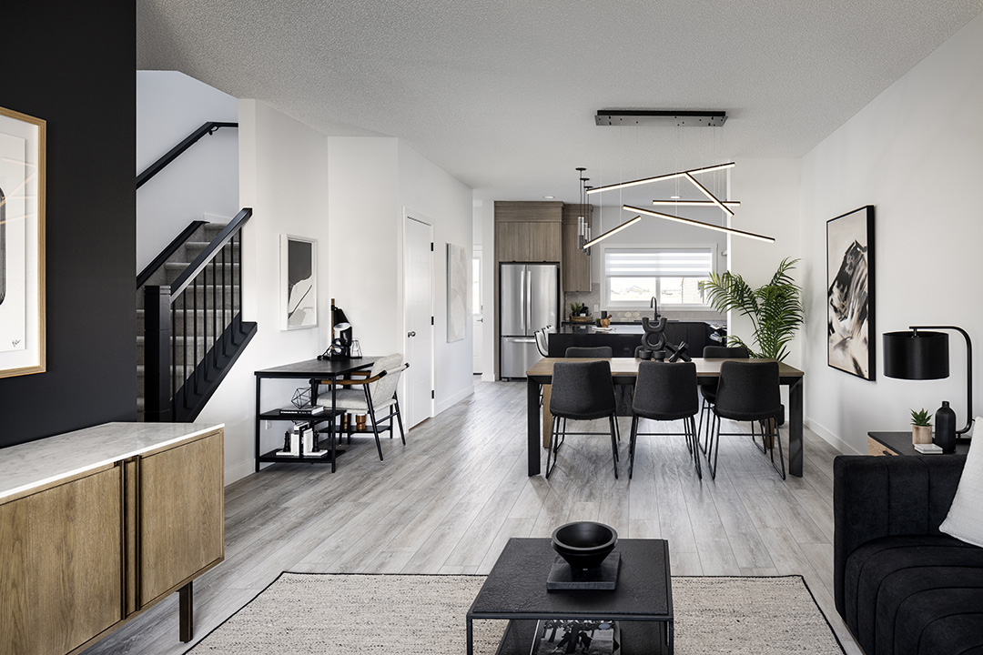 a living room with a large kitchen and a dining room