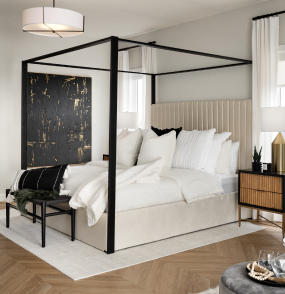 a bed with a white bedspread and a black and white bedspread