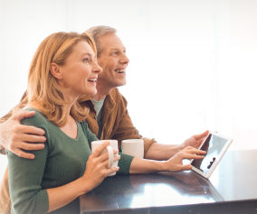 a woman and a man are talking on a cell phone