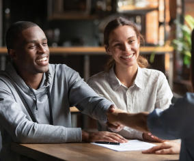 a woman and a man are sitting at a table