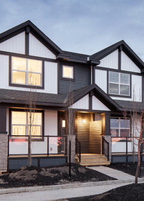 a house with a large window and a building