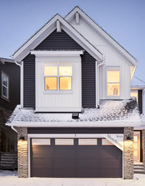 a white and blue house with a window