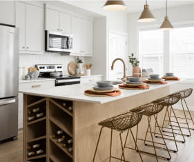 a kitchen with a stove, sink, and refrigerator