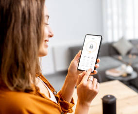 a woman holding a smart phone in her hand