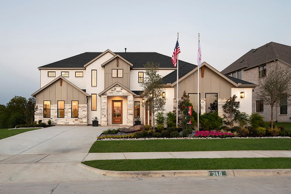 Exterior of a two-story Shane Homes home in Rockwall, Texas, photographed at dusk.