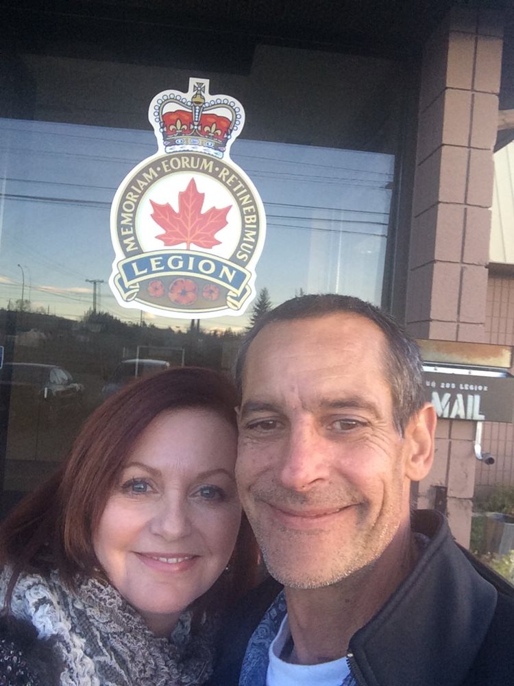 a man and a woman posing for a picture