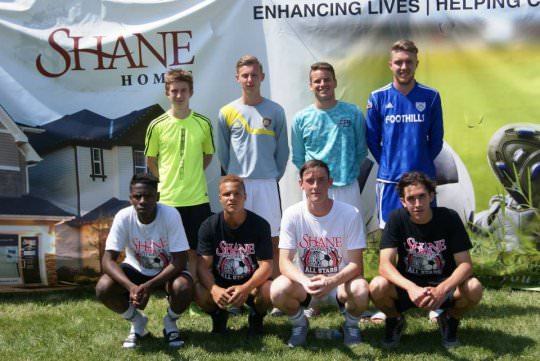 boys soccer team posing for a picture