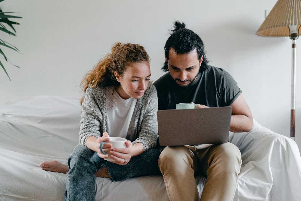 A couple looking at a laptop