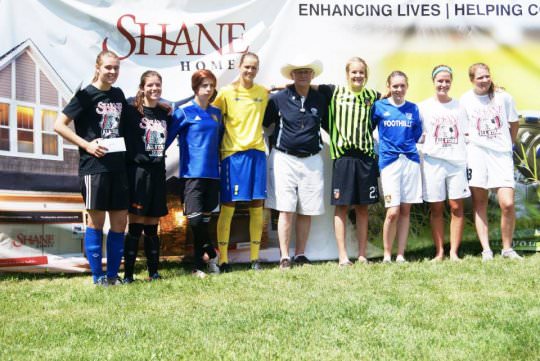 girls soccer team posing for a picture